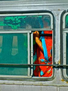 Woman Standing in a Bus
