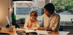 Woman Helping a Girl with Homework