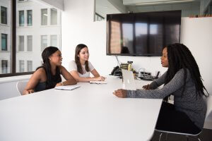 Three Woman Talking in a Office Meeting Room